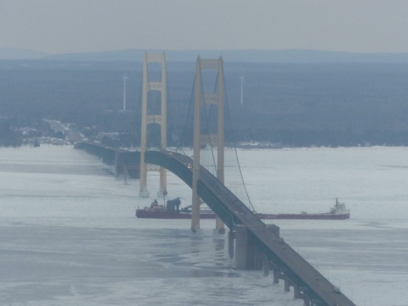 Island friend Molly McGreevy got this great shot from the air as she traveled back to the island from St. Ignace.  It's Canada Steamship Lines' Frontenac passing under the bridge.  The Frontenac has been hauling frieight in the Great Lakes for almost 50 years.