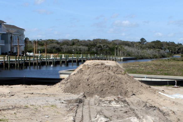 Connecting the Dots - this mound of dirt eventually became part of the foundation for our new home in Sunset Inlet.